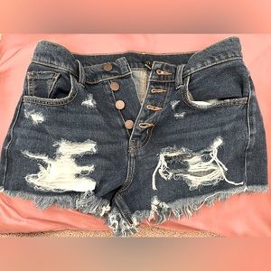 Ripped stylish dark blue jean shorts